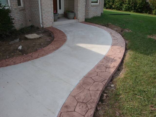 curved sidewalk with stamped ribbons